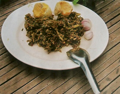 A mixture of iguana meat and greens, as well as two boiled iguana eggs. Note that the iguana eggs are all yolk and no white. <a href=></a>